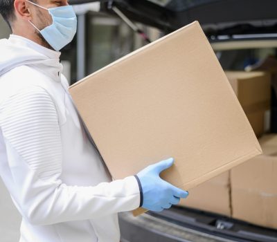 delivery-guy-carrying-cardboard-box